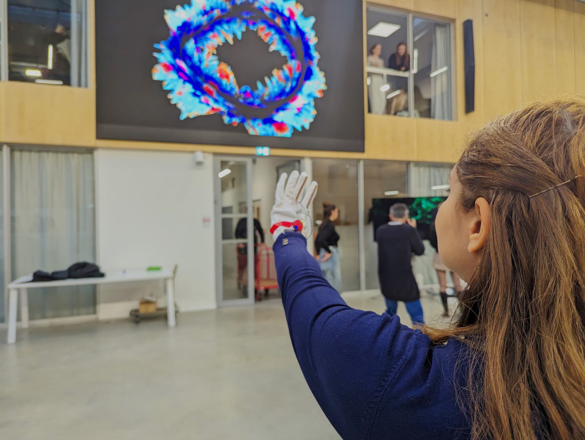 Testing a custom data glove in front of a large screen